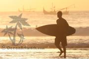 Surfer leaves the water in Bali at Sunset 316